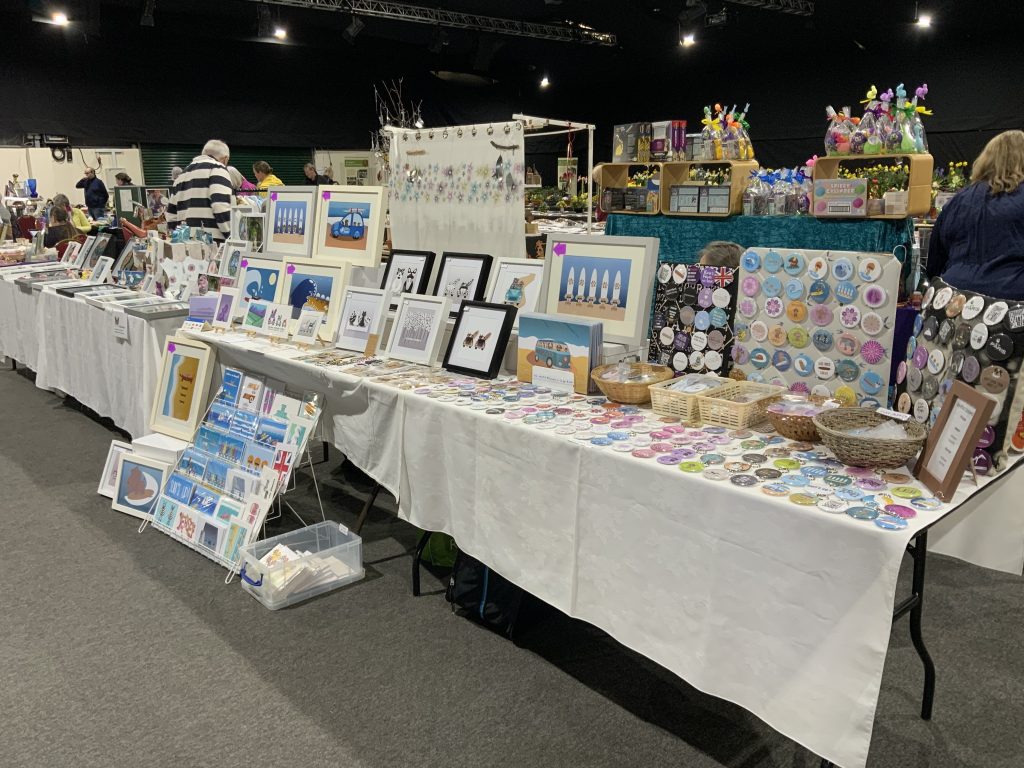 Image of Barefoot Bodeez Art products stand